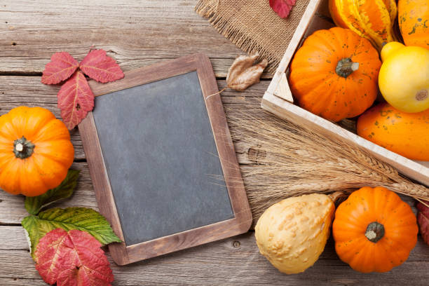 istock Autumn pumpkins on wooden table 802264426
