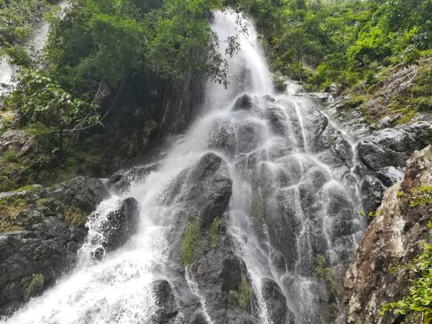 istock Big waterfall in tropical rain-forest. Waterfall in Saraburi, Thailand 802278854