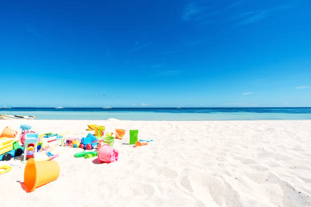 istock Beach toys on white sand 802300894