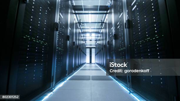Shot Of A Working Data Center With Rows Of Rack Servers Stock Photo - Download Image Now