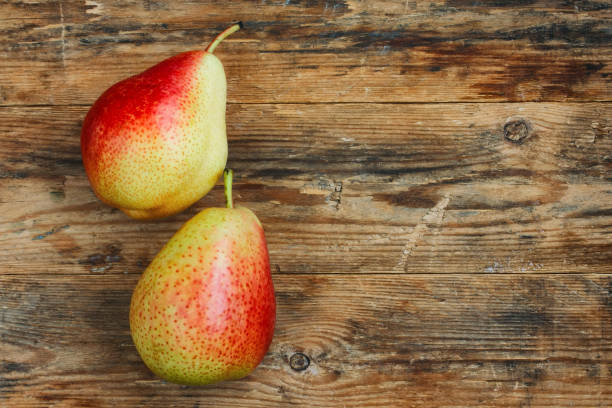 istock Two sweet ripe red pears 802312170