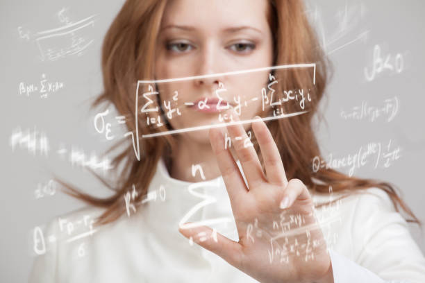istock Woman scientist or student working with various high school maths and science formula 802317082