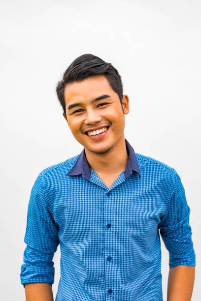 Relaxed portrait of a happy young Asian man