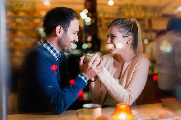 istock Happy couple talking at bar and having date 802317562