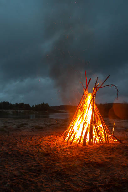 istock A large fire on the shore of the quarry. 802317694