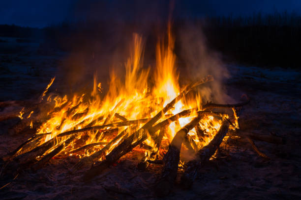 istock A large fire on the shore of the quarry. 802317908