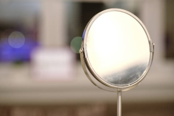 istock Close up of a bathroom sink a round mirror. 802321096