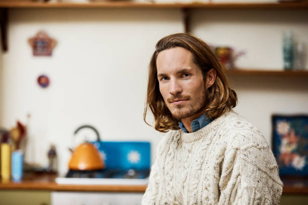 istock Portrait of man wearing sweater in kitchen 802322126