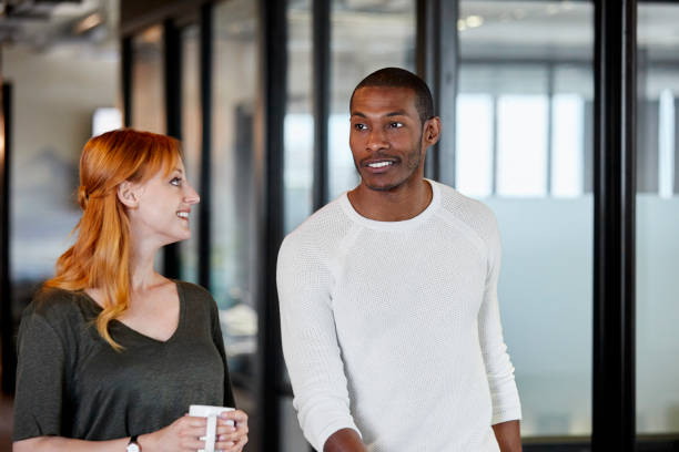 istock Businessman communicating with colleague in office 802322400