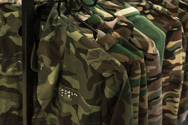 istock Jacket military style hanging on clothes rack. 802325490