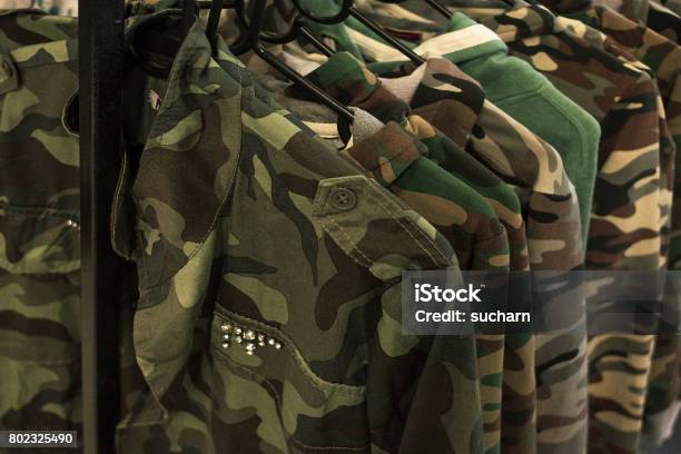 Jacket Military Style Hanging On Clothes Rack Stock Photo - Download Image Now - Military Uniform, Coathanger, Adult