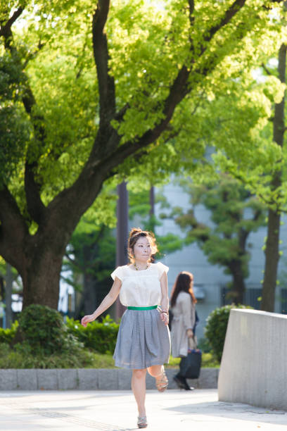 istock Japanese woman in a park 802325894