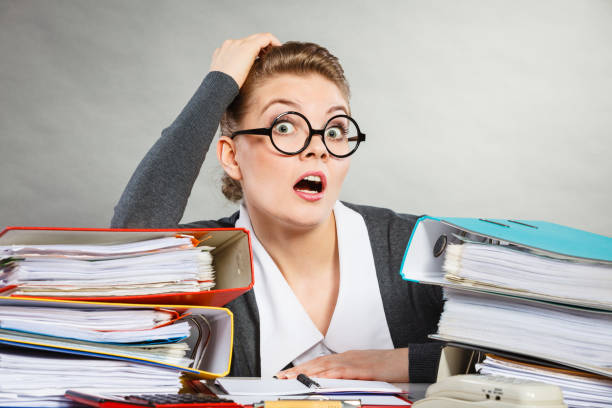 istock Panicked secretary at desk. 802326062