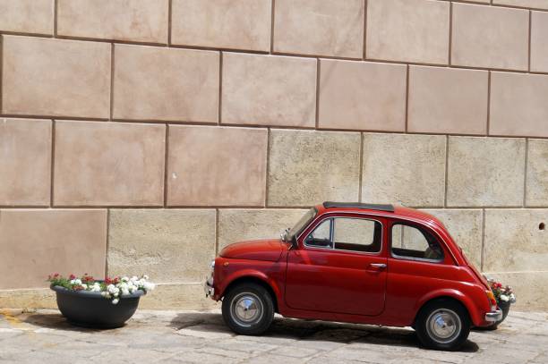 istock Red italian vintage car parked 802326820