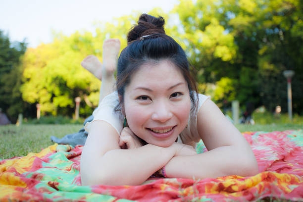 istock 2 Japanese women relaxing in a park 802333620
