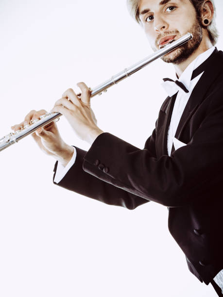 istock Male flutist wearing tailcoat plays flute 802334698