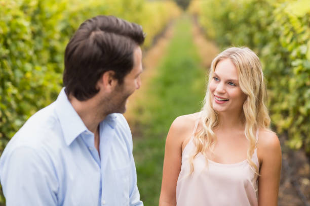 istock Young happy couple smiling at each other 802334850