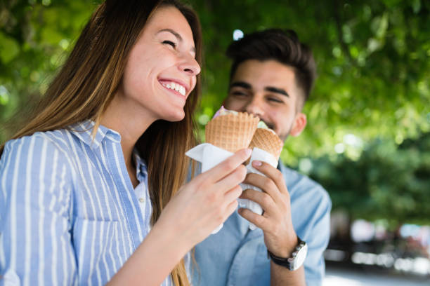 istock Happy couple having date and eating ice cream 802335010