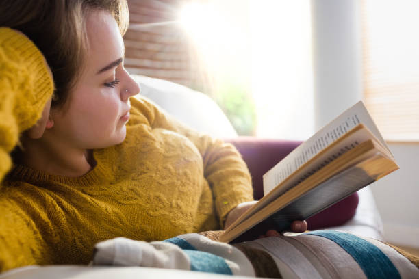 istock Pretty woman reading a book 802337154