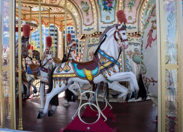 istock Carnival horse on merry go round carousel ride 802341610