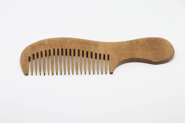 istock Classic Wooden comb isolated on white baclground 802342202