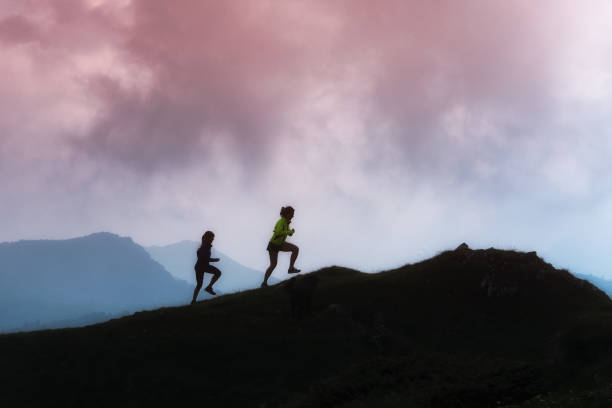 istock Mountain racing training of two girls 802349550