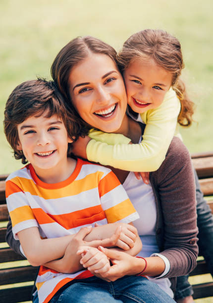 istock Mother with her children 802353040