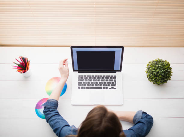 istock Overhead view of businesswoman using laptop 802362896