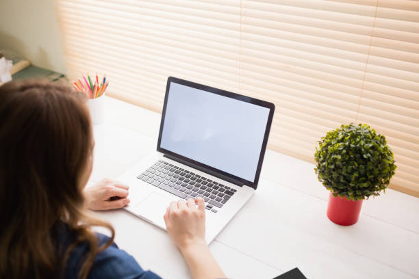 istock Hipster businesswoman using her laptop 802362992