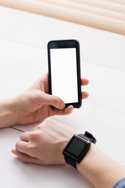 istock Casual businessman using phone and smart watch 802373614