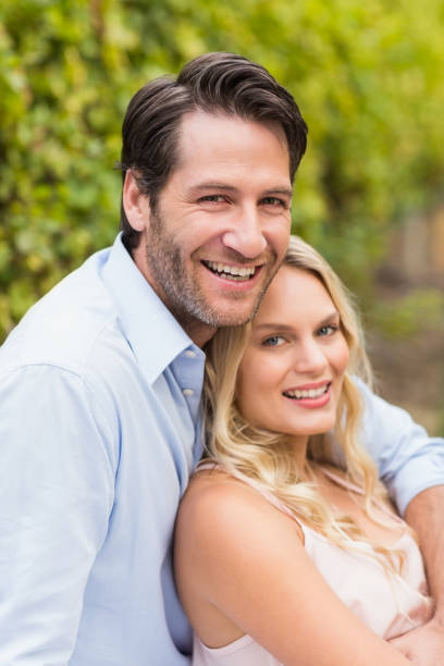 istock Young happy man embracing his girlfriend 802377834