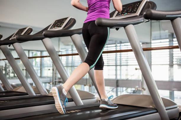 istock Lower section of fit woman on treadmill 802378262