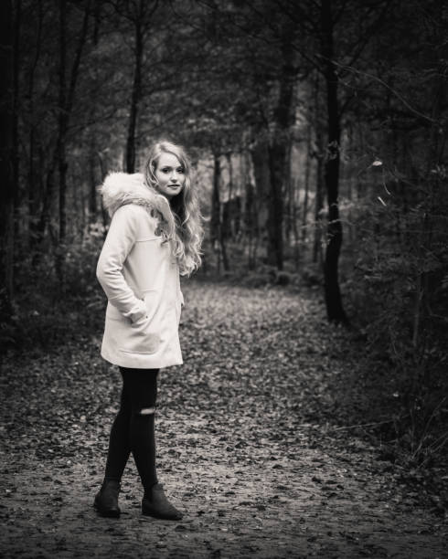 istock Young blonde woman in woods 802380480