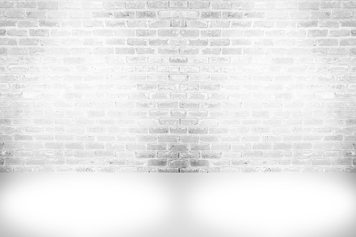 Abstract aged paint white brick wall background , grunge rusty blocks of stonework horizontal architecture wallpaper with spotlight lamps