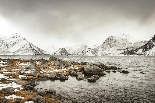 Scenic view over a Fjord in a winter landscape in the Lofoten archipel in Norway.