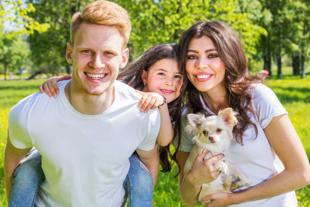 istock Happy family with a dog 802386768