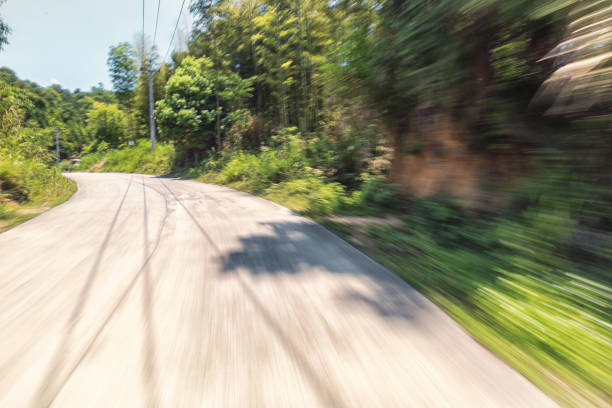 istock concrete rural road in the sunny day 802390510