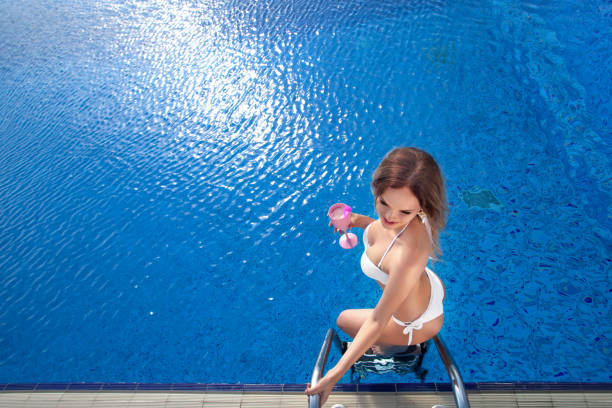 istock woman on pool in bikini 802390570