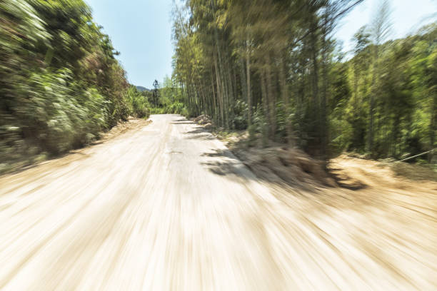 istock concrete rural road in the sunny day 802390846