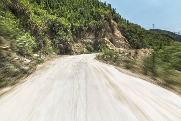 istock concrete rural road in the sunny day 802391286