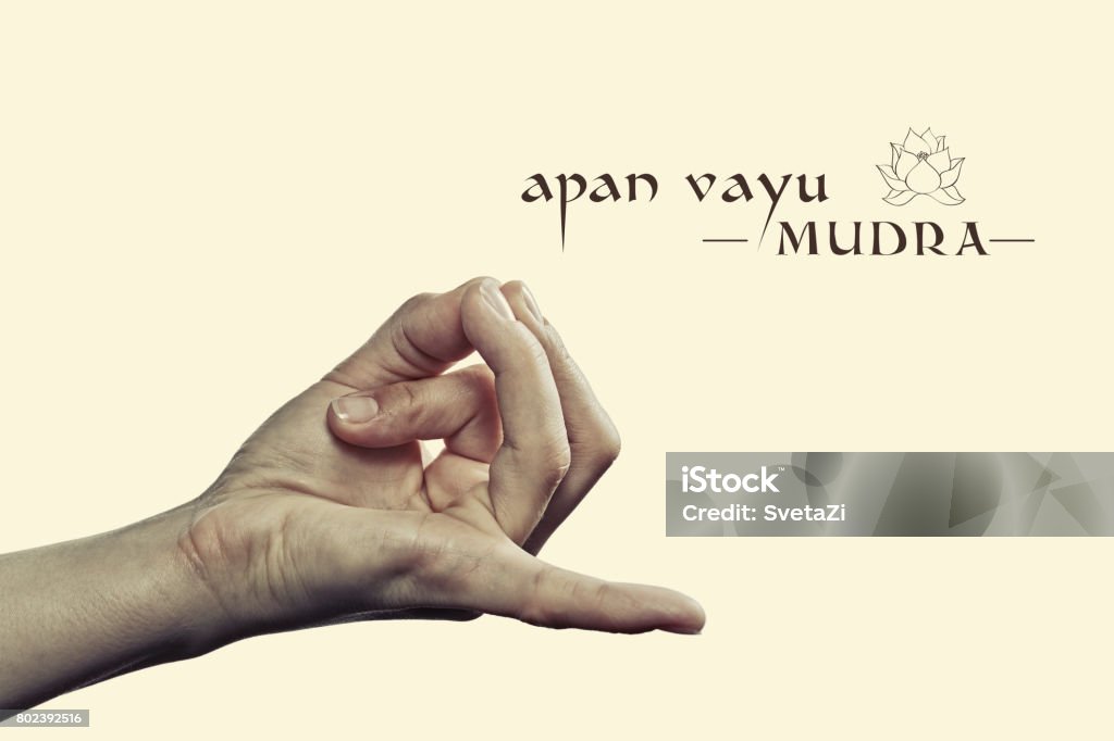 Apan vayu mudra. Apan vayu mudra. Yogic hand gesture. Isolated on toned background. Mudra Stock Photo