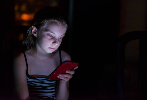 istock Setting her alarm for an early wake up 802403388