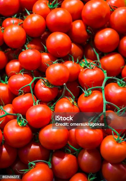 Pile Of Tomatoes Bunch In Greengrocer Shop Stock Photo - Download Image Now - Tomato, Close-up, Food