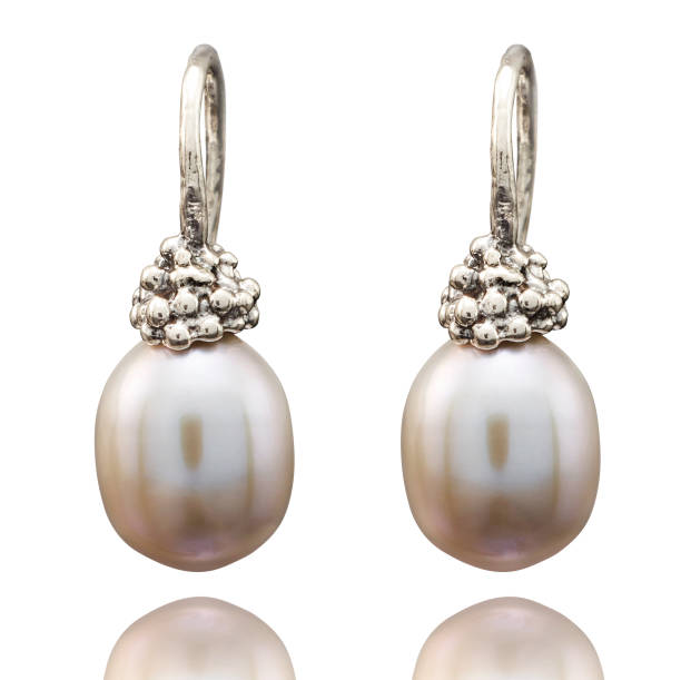 istock Golden earrings with gemstone isolated on white background 802413614