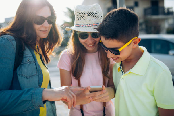 istock Family on the traveling using smart phone 802417248