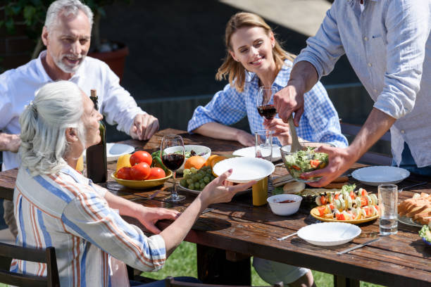 istock happy family of two generations having outdoors picnic together 802428022