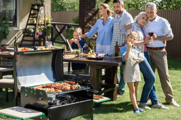 istock happy multi-generational family having lunch on patio at sunny day 802428318