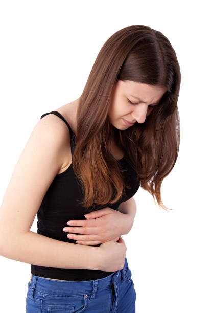 istock girl with stomach ache 802428980
