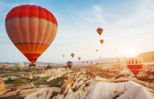 istock Hot air balloon flying over rock landscape at Turkey. Cappadocia 802429006
