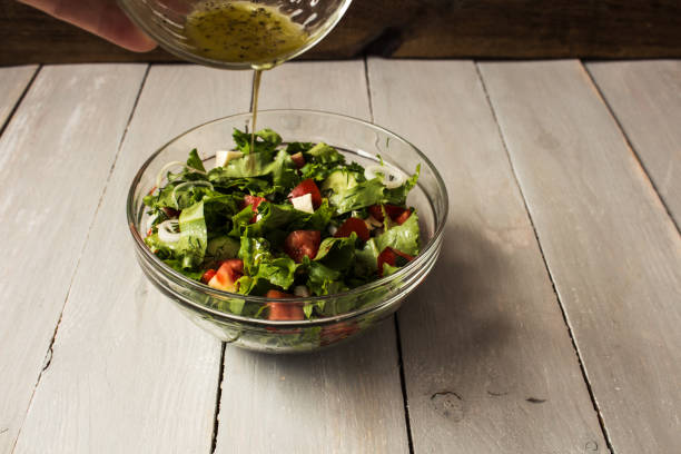 istock bowl of fresh salad with salad dressing 802439674